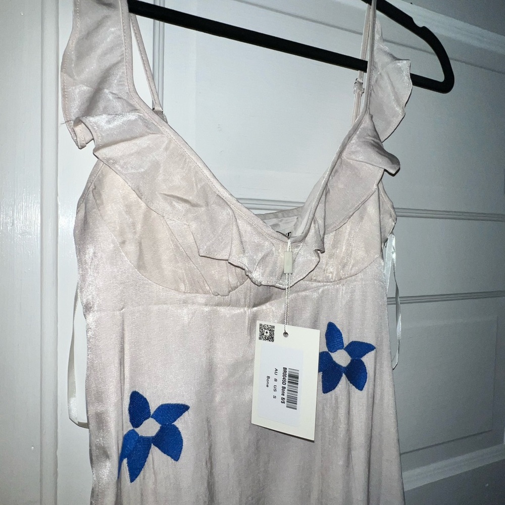 Elegant Cream Dress with Blue Floral Accents